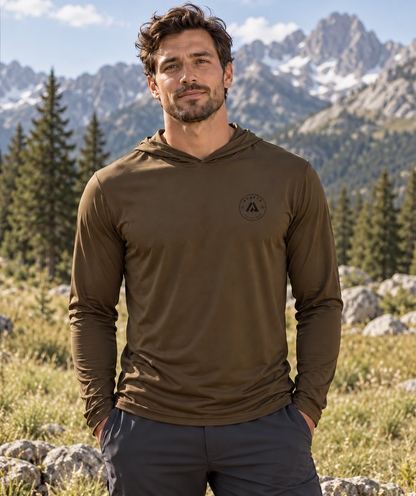 AI-generated lifestyle mockup: Coyote Brown Waypoint hooded shirt with approximately two-inch round Awaken chest logo